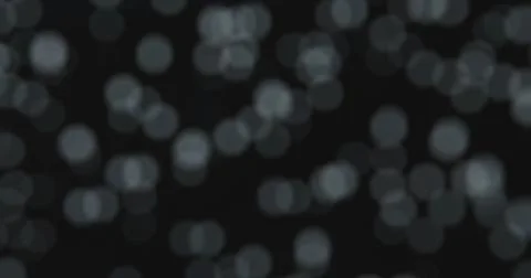 Abstract blurred bokeh circles on a black background Stock Illustration