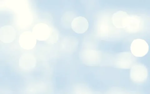 Abstract blurred bokeh light on light blue blackground Stock Photos