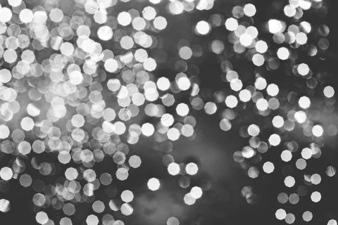 Abstract blurred bokeh light with warm tone color background concept. Stock Photos