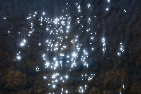 Abstract blurred bokeh lights creating a sparkling blue pattern Stock Photos