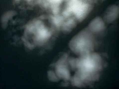 Abstract Blurred Bokeh Shadow Pattern on Dark Textured Surface Stock Photos