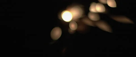 Abstract blurred bokeh of a sparkler burning down in the dark. Stock Footage 132963196