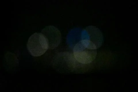 Abstract Blurred Circles on Dark Background Stock Photos