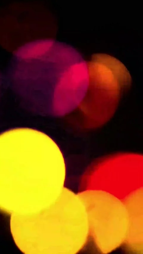 Abstract blurred circles of light in vibrant yellow orange and pink colors for Stock-Footage 347484735