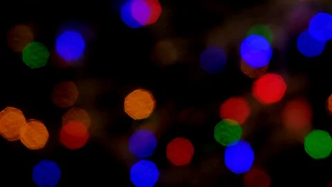 Abstract blurred of colored glittering shine bulbs lights on black background. Stock Footage 120062658