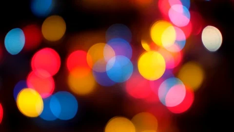 Abstract blurred of colored glittering shine bulbs lights on black background. Video stock 120135918