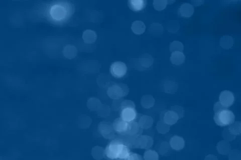 Abstract blurred dark blue background with beautiful bokeh effect. Stock Photos