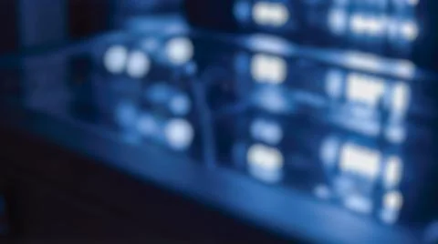 Abstract blurred dark blue server room featuring glowing indicator lights r.. Stockfoto's