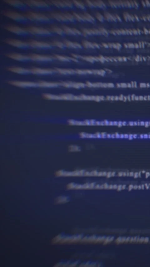 Abstract blurred digital code on a dark screen, representing programming, c.. Stock Footage 312927736