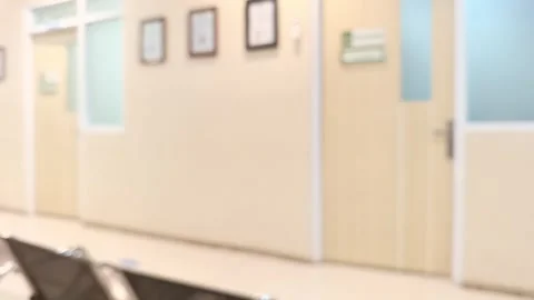 Abstract blurred footage of a clean, empty hospital waiting room hallway. Stock Footage 318595462