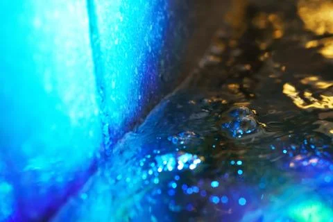 Abstract blurred futuristic sci-fi fountain water with reflection of lights b Stock Photos
