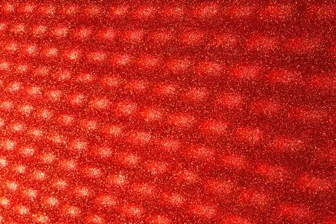 Abstract blurred glitter background in red colors. 写真素材