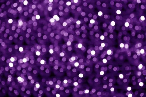 Abstract blurred glowing light particles of shades of purple and white Foto stock