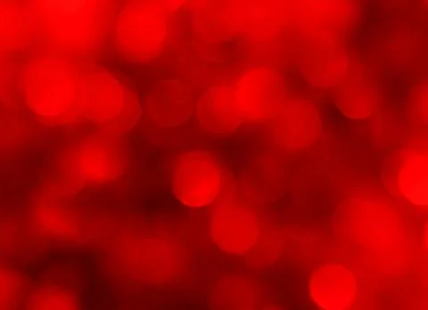 Abstract blurred glowing light particles of shades of red Stock Photos