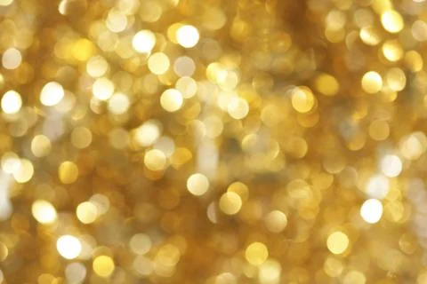 Abstract blurred glowing lights of light gold shades Foto stock