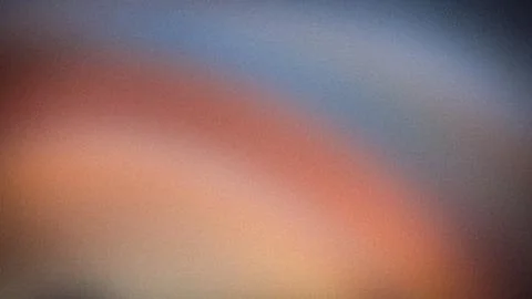 Abstract blurred gradient background with blue, red, and beige colors in 4K.. Stock Photos