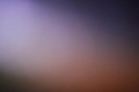 Abstract blurred gradient background with soft purple and orange light Stock Photos