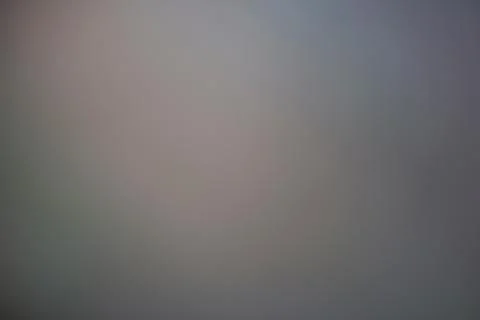 Abstract blurred grey background with soft light and smooth gradient texture Stock Photos