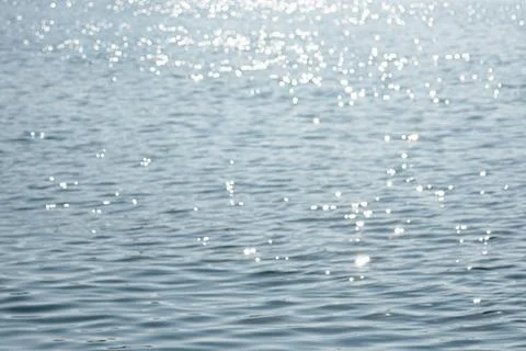Abstract blurred image of blurred soft light bokeh on the sea background. B.. Stock Photos
