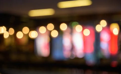 Abstract blurred image of cafe or restaurant with bokeh lights background Stock Photos