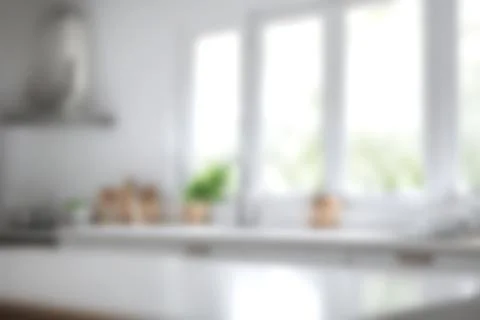 Abstract blurred image of kitchen room with soft light for background usage.. Stock Photos