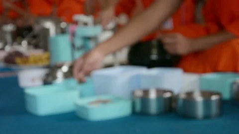 Abstract blurred image of monks eating food and drink Stock Footage 90834667
