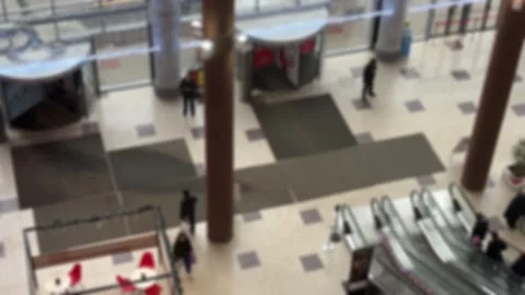 Abstract blurred image of people using entrance and exit and escalator in 库存影片 333254265