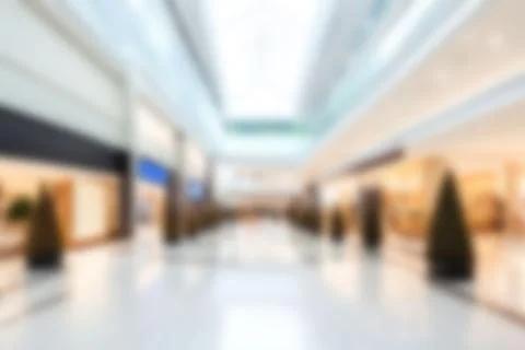 Abstract blurred image of shopping mall with light and bokeh for background.. Stock Photos