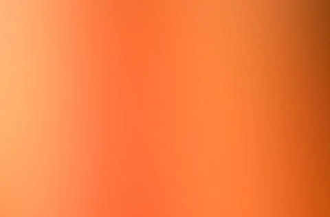 Abstract blurred image of smooth vibrant orange gradient background Stockillustratie