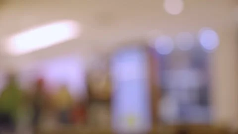 Abstract blurred interior of a modern shopping mall or store with bright bokeh l 動画素材 323231806