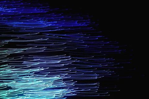 Abstract blurred light on the black background Stock Photos