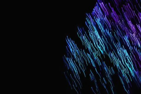 Abstract blurred light on the black background Stock Photos
