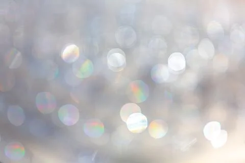 Abstract blurred lights creating festive bokeh effect with rainbow highlights 库存照片