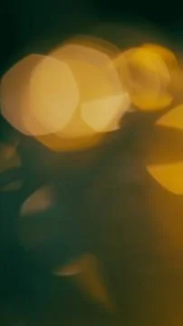 Abstract blurred lights in warm tones creating a bokeh effect Stock Photos