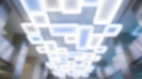 Abstract blurred modern ceiling lighting featuring bright geometric rectang.. Stock Photos