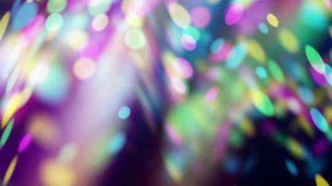Abstract blurred multicolor light circles flowing against a dark background Stock Footage 336918571