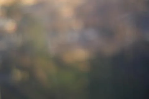 Abstract blurred nature background with soft green, blue and warm tones Stock Photos
