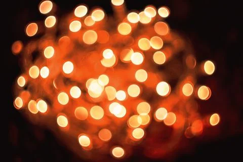 Abstract blurred orange lights background glowing in the dark with festive mo 스톡 사진