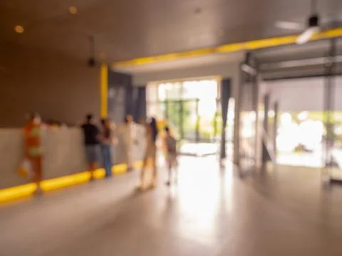 Abstract blurred people checking in at front desk, luxury interior hotel ba.. Stock Photos