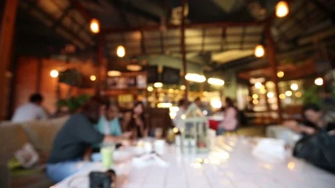 Abstract blurred people sitting in coffee restaurant shop talking together Stock Footage 76244097