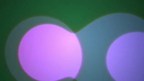 Abstract blurred purple and blue light bokeh circles floating on dark green.. Stock Footage 346318976