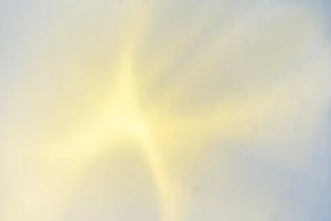Abstract blurred rainbow glitter background. Yellow light. Stock Photos