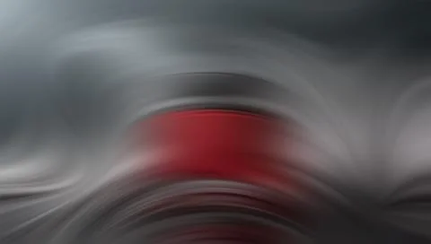 Abstract blurred red and gray swirling motion background Stockillustratie