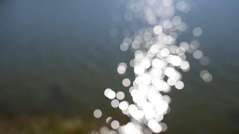 Abstract blurred reflection of sunlight in lake. Bokeh background. Stock Footage 101485664