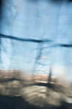 Abstract of Blurred Reflection of a Window with View of Outdoors Stock Photos