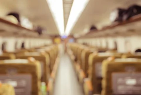 Abstract blurred train Interior of a passenger car background. Stock Photos