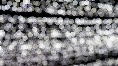 Abstract blurred white lights on black background Stock Footage 145955337
