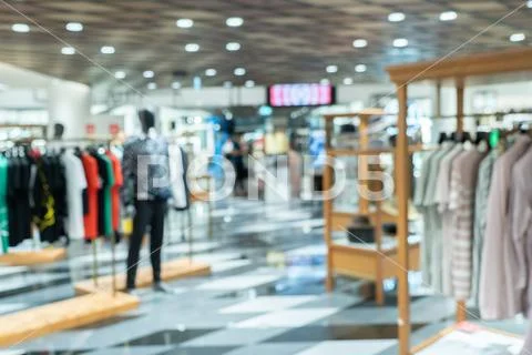Abstract blurry background of retail shops in shopping mall or department sto Stock Photos