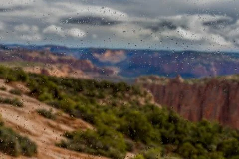 Abstract blurry background: view through the wet window Monument valley usa Stock Photos