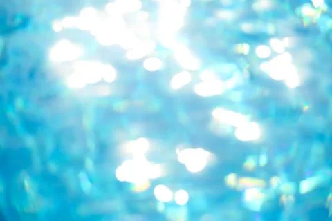 Abstract blurry background of water surface in swimming pool. Stock Photos